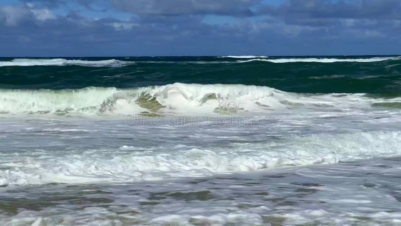 Ocean waves on sandy beach