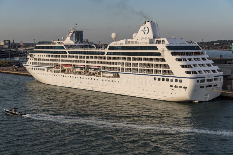 Oceania lines Nautica alongside at 38/9 berth in Southampton UK. MS Nautica is a cruise ship, built for Renaissance cruises as part of their R class. Nautica is now owned and operated by Oceania Cruises, where she is part of their Regatta Class. She was built in 2000 by the Chantiers de l`Atlantique shipyard in Saint-Nazaire, France for Renaissance Cruises as MS R FiveThe Port of Southampton is a passenger and cargo port in the central part of the south coast of England. The modern era in the history of the Port of Southampton began when the first dock was inaugurated in 1843. Oceania lines Nautica alongside at 38/9 berth in Southampton UK. MS Nautica is a cruise ship, built for Renaissance cruises as part of their R class. Nautica is now owned and operated by Oceania Cruises, where she is part of their Regatta Class. She was built in 2000 by the Chantiers de l`Atlantique shipyard in Saint-Nazaire, France for Renaissance Cruises as MS R FiveThe Port of Southampton is a passenger and cargo port in the central part of the south coast of England. The modern era in the history of the Port of Southampton began when the first dock was inaugurated in 1843