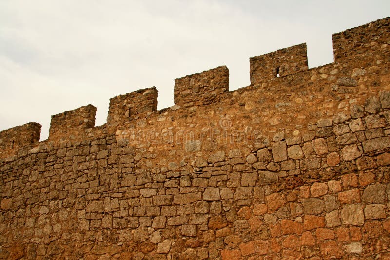 High and thick medieval wall to control things and keep everybody out. High and thick medieval wall to control things and keep everybody out