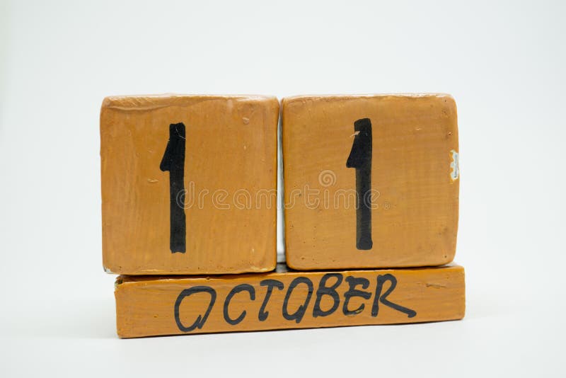 october 11th. Day 11 of month, handmade wood calendar isolated on white background. autumn month, day of the year concept