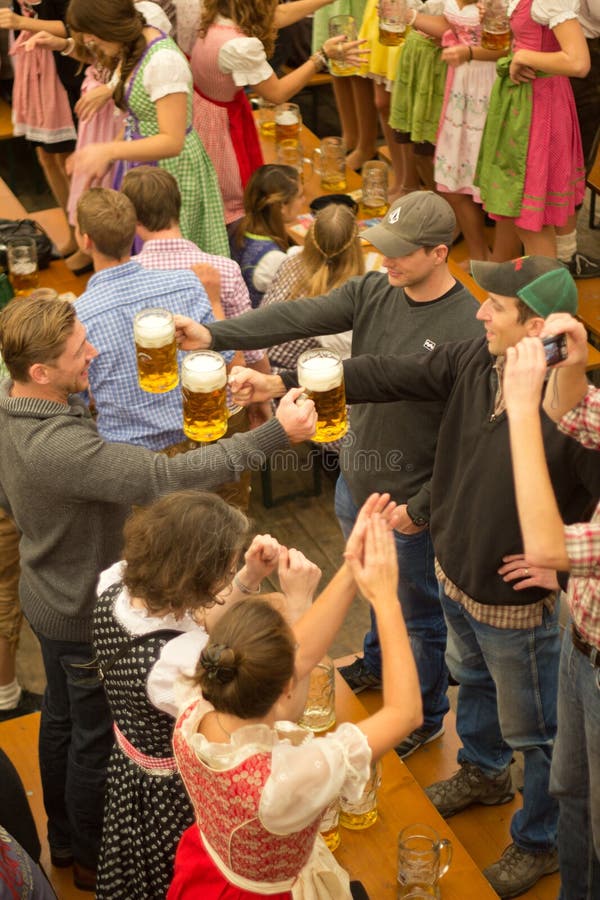 Young men drinking beer on Octoberfest in Munich. Young men drinking beer on Octoberfest in Munich