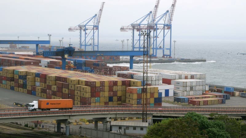 Marine port cranes, container terminal and industrial zone in cargo front of Odessa sea commercial port in Ukraine.