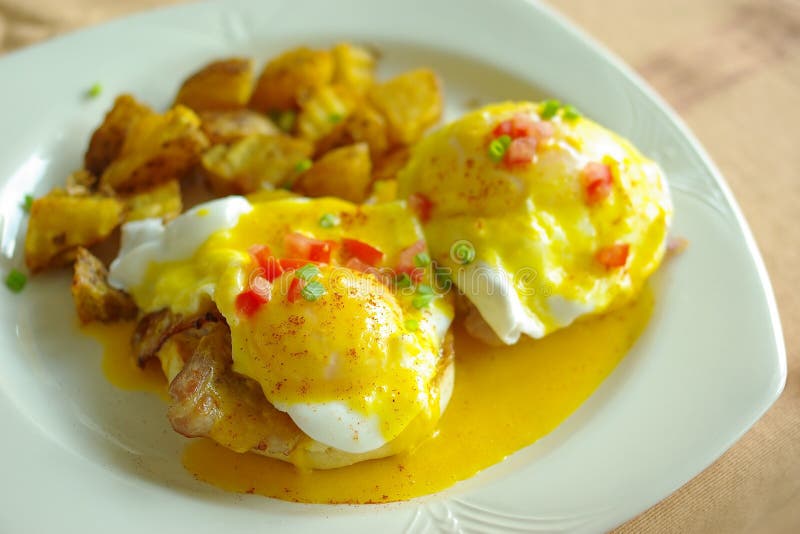 Delicious eggs benedict for breakfast, selective focus. Delicious eggs benedict for breakfast, selective focus