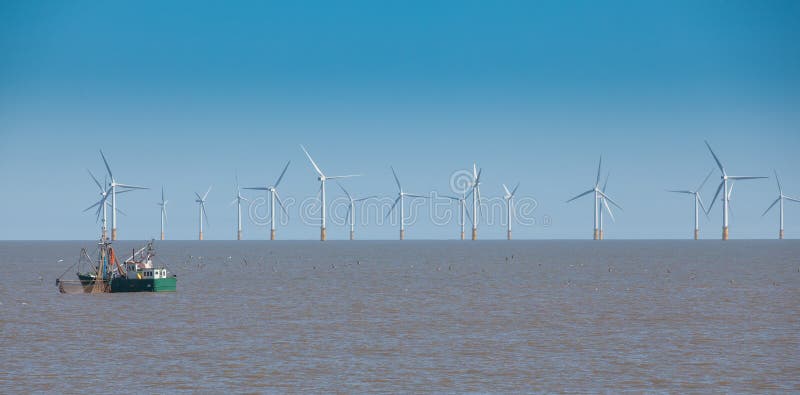 Off sure wind turbine and fishing boat