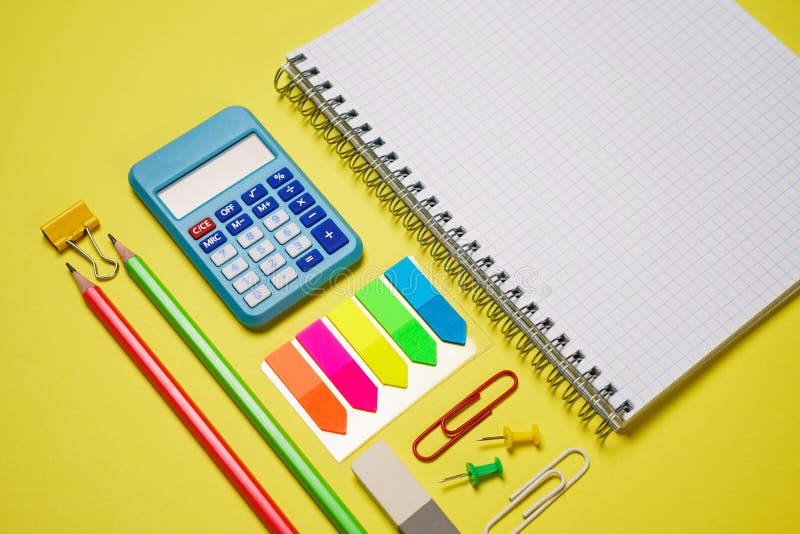 Office accessories on yellow background with copy space. View from above. Back stock photography