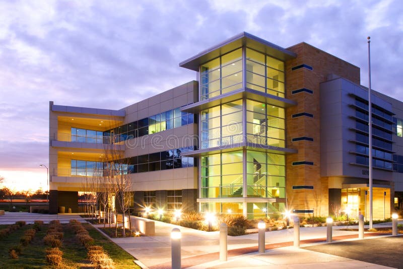 An office building with a empty parking lot