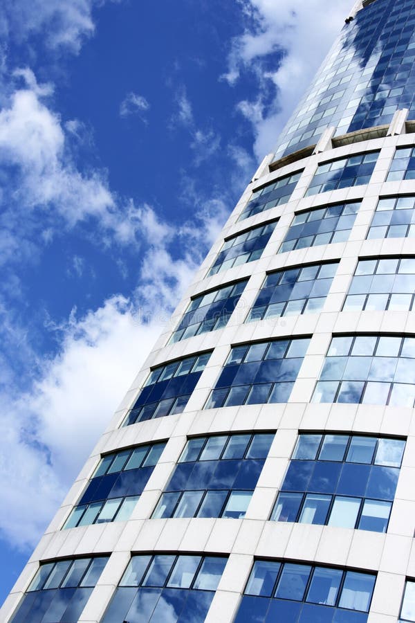 Wall of office building and sky reflection in the windows. Window color reflection background stock images, royalty-free photos and pictures