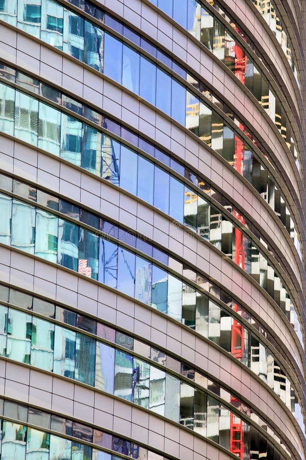 Modern round office building abstract architecture, reflections on windows. Modern round office building abstract architecture, reflections on windows.