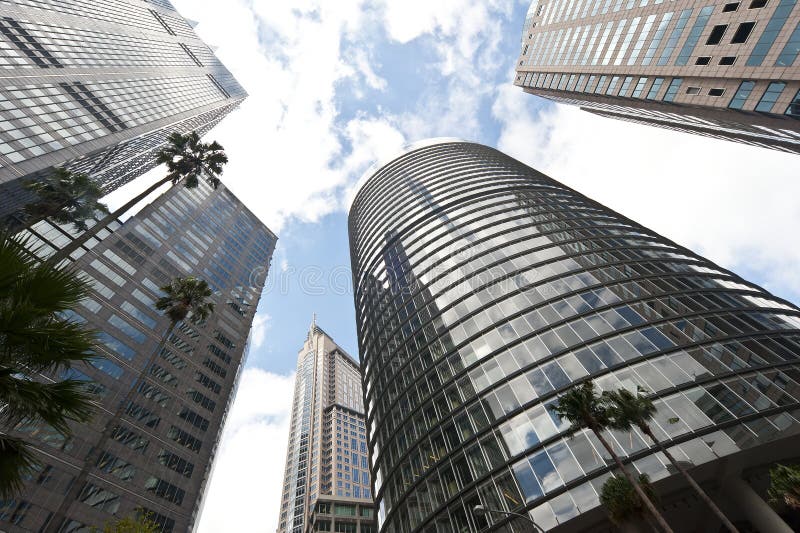 Office buildings in the centre of Sydney shot to take in the sky and the reflections on the buildings. Copyspace. Office buildings in the centre of Sydney shot to take in the sky and the reflections on the buildings. Copyspace.