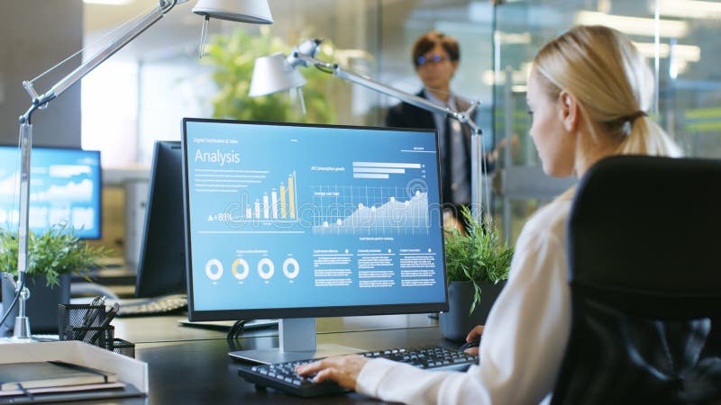 In the Office Businesswoman at Her Desk, She`s Using Personal Co royalty free stock photography In the Office Businesswoman at Her Desk, She`s Using Personal Co royalty free stock photography
