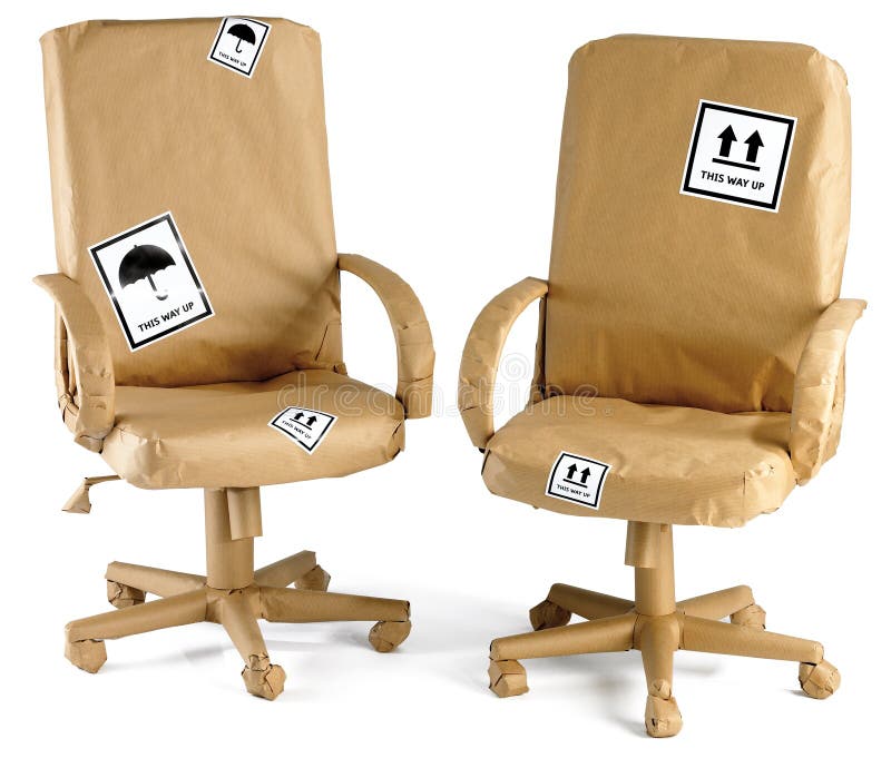 Office Chairs All Wrapped Up In Brown Paper For A Stock Photo Image