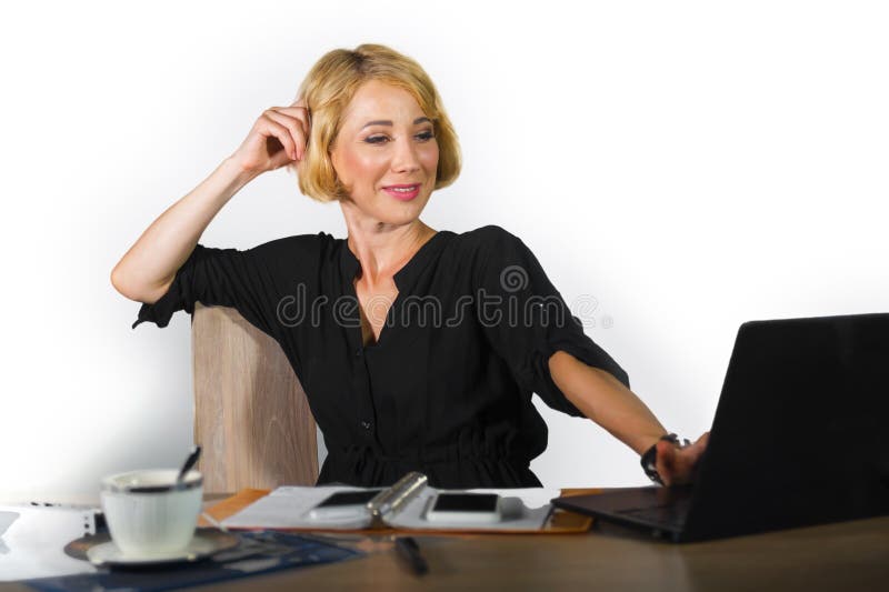 Office corporate portrait of young beautiful and happy business woman working relaxed at laptop computer desk smiling confident in