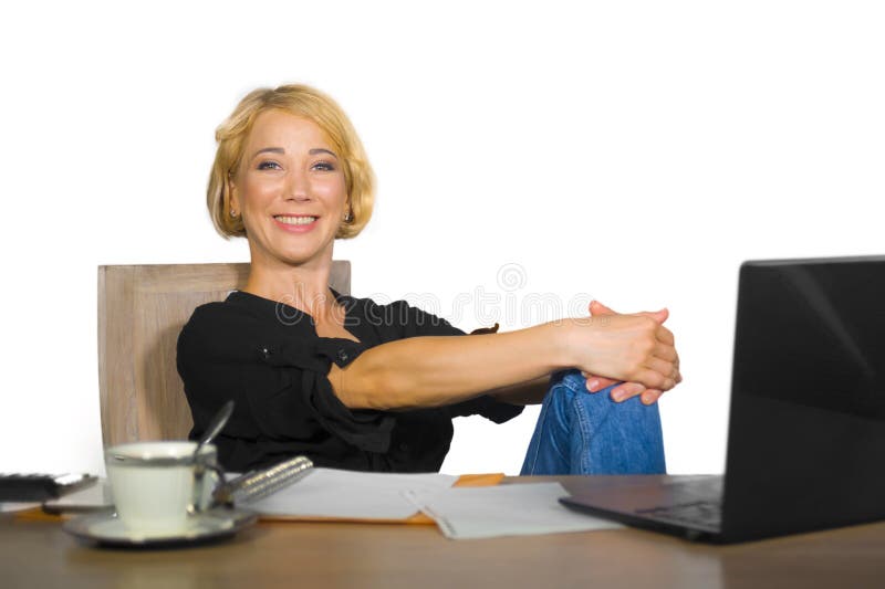 Office corporate portrait of young beautiful and happy business woman working relaxed at laptop computer desk smiling confident in