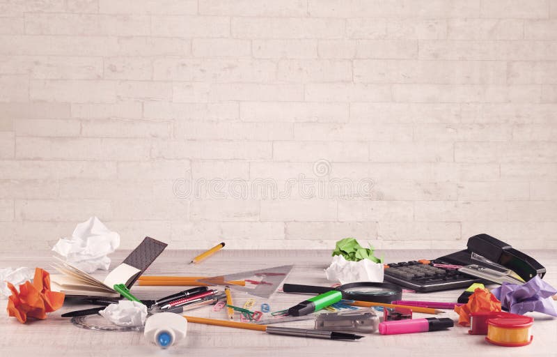 Office desk closeup with white brick wall