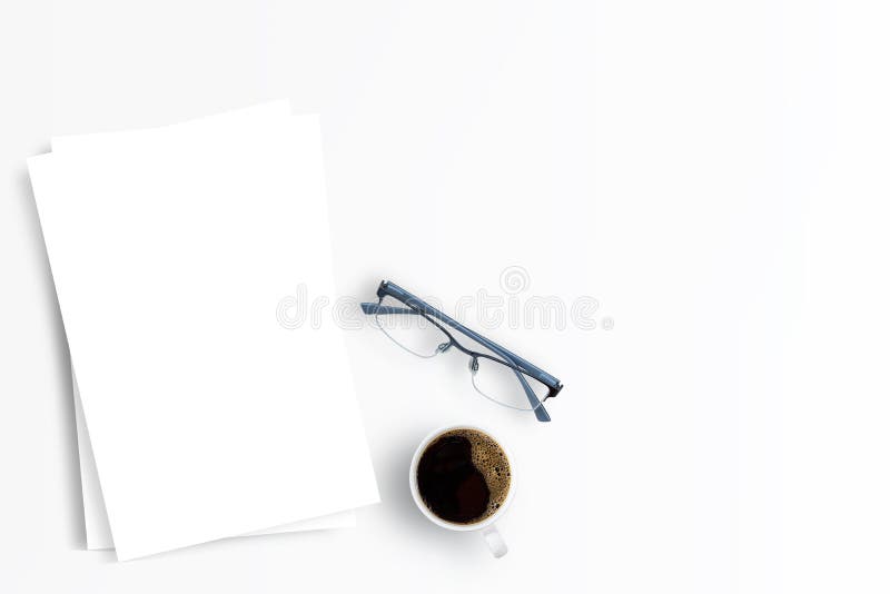 Office desk coffee cup and white paper on a white background.