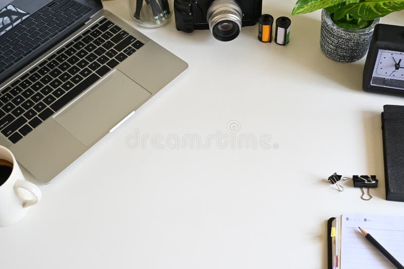 Office Desk with a Creative Device and Gadget on White Table Stock