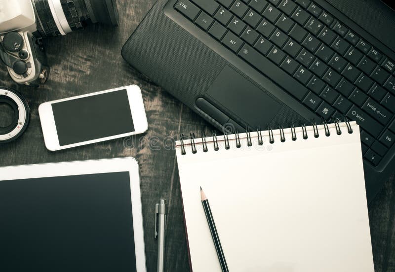 Office desk table with computer, supplies and tablet, mobile phone. Top view with copy space. royalty free stock photo Office desk table with computer, supplies and tablet, mobile phone. Top view with copy space. royalty free stock photo