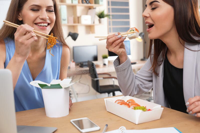 Office Employees Having Lunch at Workplace. Stock Image - Image of ...