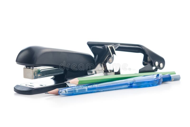 Office equipment. Stapler, pencils and hole puncher isolated on white background stock photo