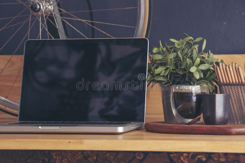 Office laptop business financial document chart and graph on wooden table with coffee cup. Flat lay notebook computer laptop on stock photos