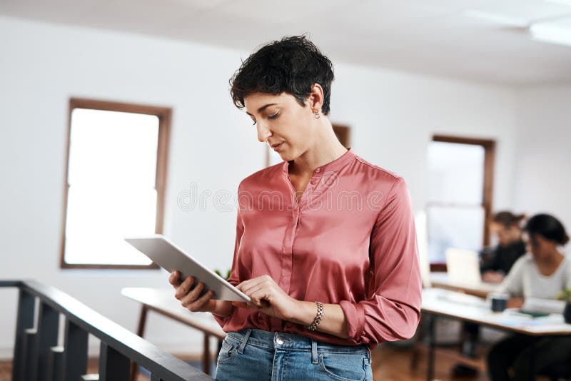 Office, planning and woman with research on tablet for web development, update or communication. Company, developer and stock images