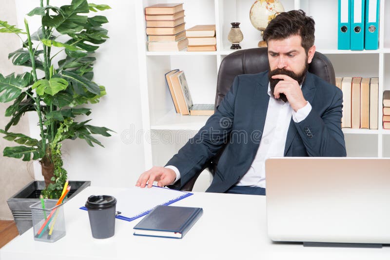 Office routine. Manager solving business problems. Businessman in charge of business solutions. Developing business strategy. Risky business. Man bearded hipster boss sit office with laptop. Developing programmer stock images, royalty-free photos and pictures