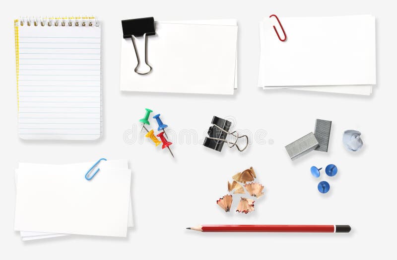 Office Stuff. Variety of office stationery, isolated on white. Includes spiral notebook, blank labels, bulldog clip, push pins, staples, pencil and pencil Office Stuff. Variety of office stationery, isolated on white. Includes spiral notebook, blank labels, bulldog clip, push pins, staples, pencil and pencil