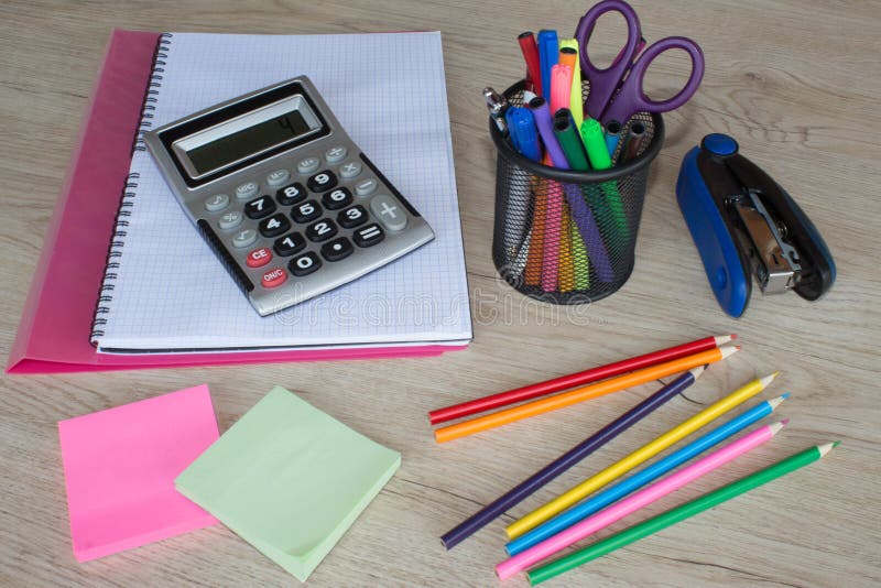 Office Tools with Empty Notebook and Euro Bills on Wooden Table