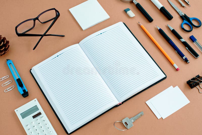 Office Supplies Neatly Organized Around Notebook