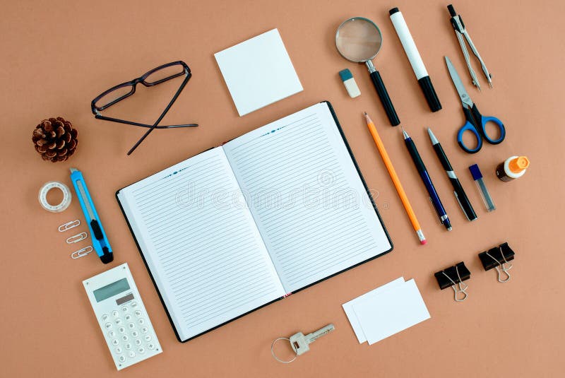 Office Supplies Neatly Organized Around Notebook