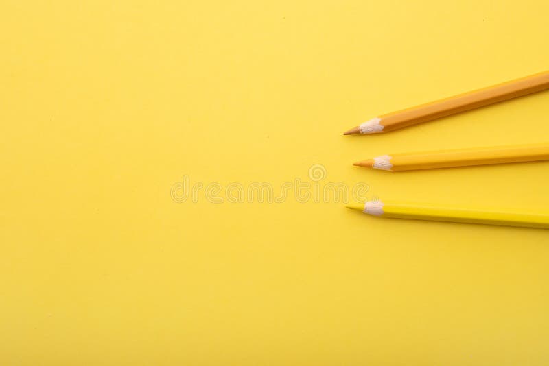 So prepared pencil crayons on a yellow background along with other tools. Background for office work. So prepared pencil crayons on a yellow background along with other tools. Background for office work.