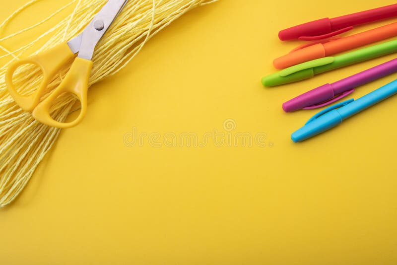 So prepared pencil crayons on a yellow background along with other tools. Background for office work. So prepared pencil crayons on a yellow background along with other tools. Background for office work.