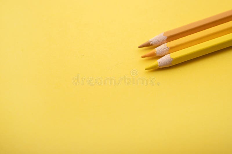 So prepared pencil crayons on a yellow background along with other tools. Background for office work. So prepared pencil crayons on a yellow background along with other tools. Background for office work.