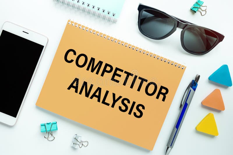 Notebook with Text COMPETITOR ANALYSIS Near Office Supplies Stock Photo