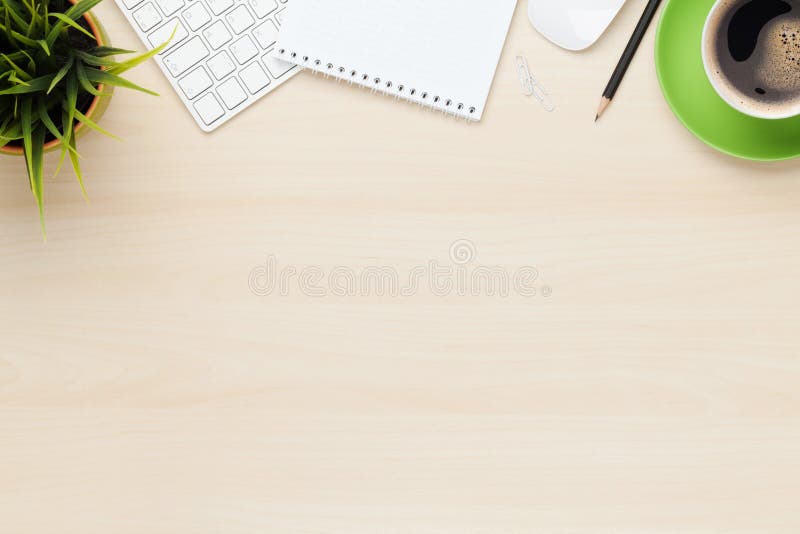 Office table with notepad, computer and coffee cup stock photo