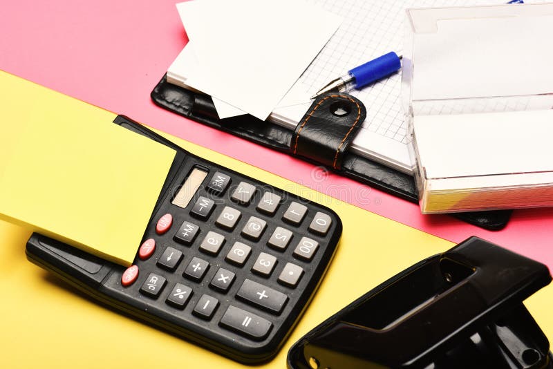 Open notebook with blank pages, leather covered and calculator stock images