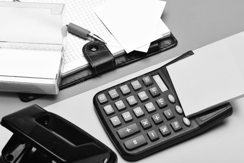 Open notebook with blank pages, leather covered and calculator stock image