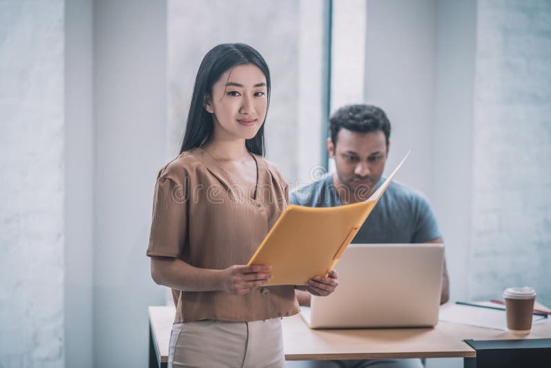 A chief and his assistant working in the office stock photography