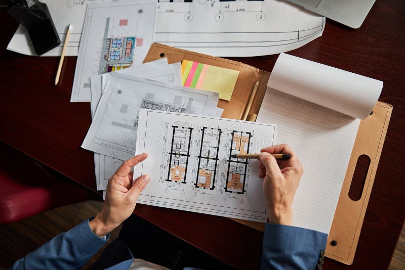 Office Worker Checking Important Documents at the Desk Stock Photo
