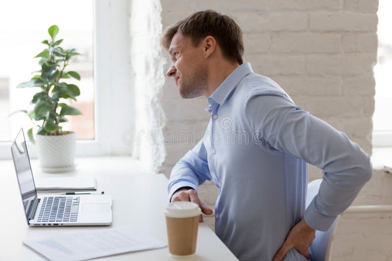 Office worker having strong lower back pain royalty free stock images Office worker having strong lower back pain royalty free stock images