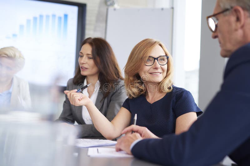 Office Workers Having Consultations during Conference Stock Image