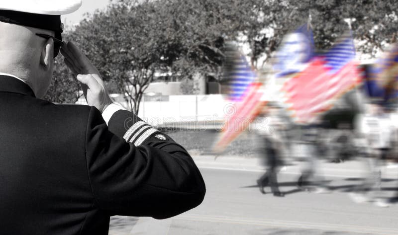 Officer saluting veterans
