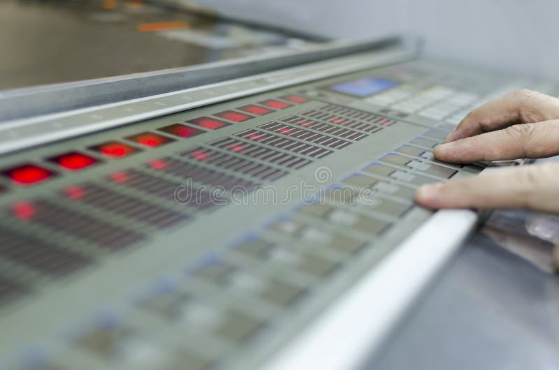 Offset machine press print run at table stock photo