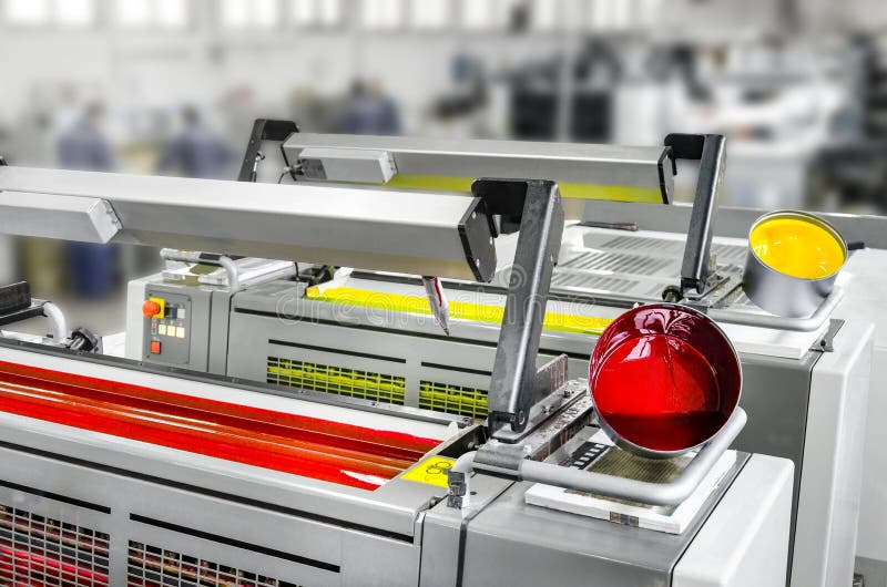 Offset print machine printing unit magenta and yellow with color pots stock images
