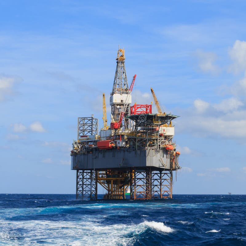 Offshore Jack Up Drilling Rig Over the Production Platform Stock Image