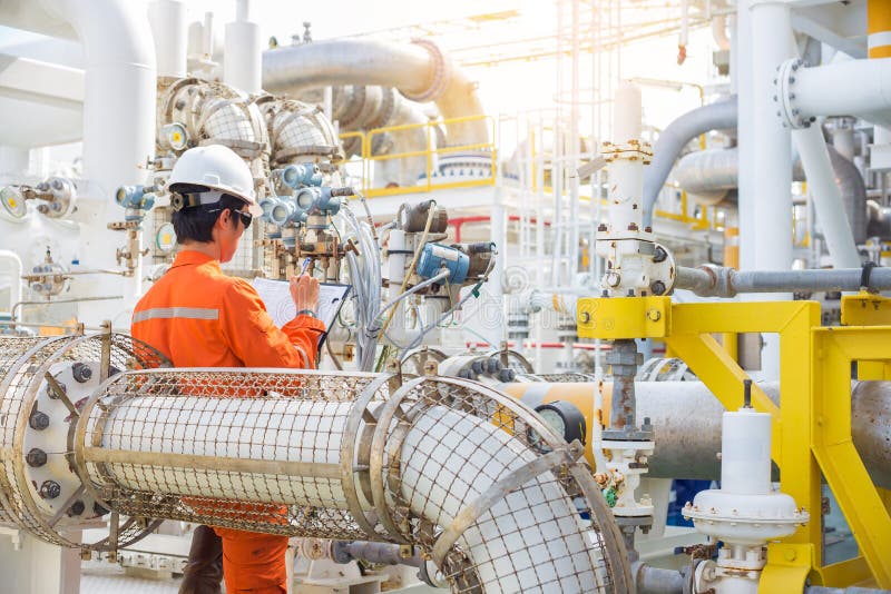 Offshore oil and gas industry, Production operator record data to log book,dialy activity of oil rig worker. royalty free stock photography Offshore oil and gas industry, Production operator record data to log book,dialy activity of oil rig worker. royalty free stock photography