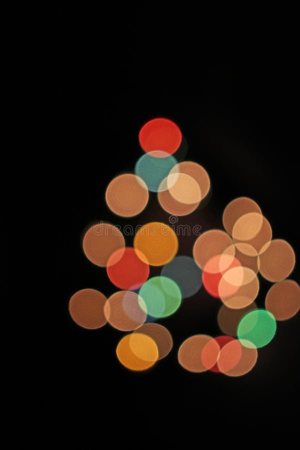 Offuschi i punti leggeri vaghi di natale del bokeh defocused delle luci fotografia stock libera da diritti Offuschi i punti leggeri vaghi di natale del bokeh defocused delle luci fotografia stock libera da diritti