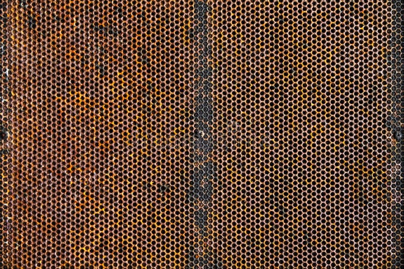Oid and Grunge Weathered Rusty Metal Plate with Pattern Holes Te royalty free stock photo Oid and Grunge Weathered Rusty Metal Plate with Pattern Holes Te royalty free stock photo