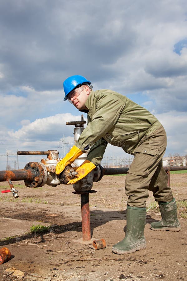 Oil company worker on the well stock photo