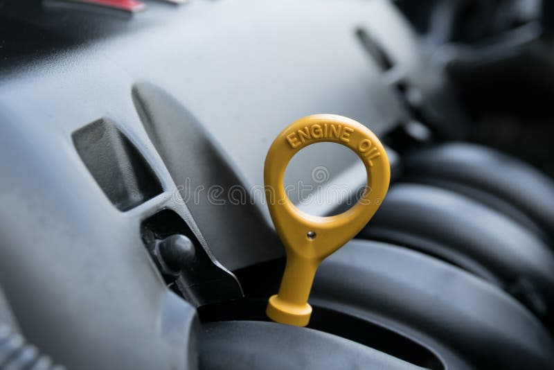 The oil dipstick of a car engine stock photos